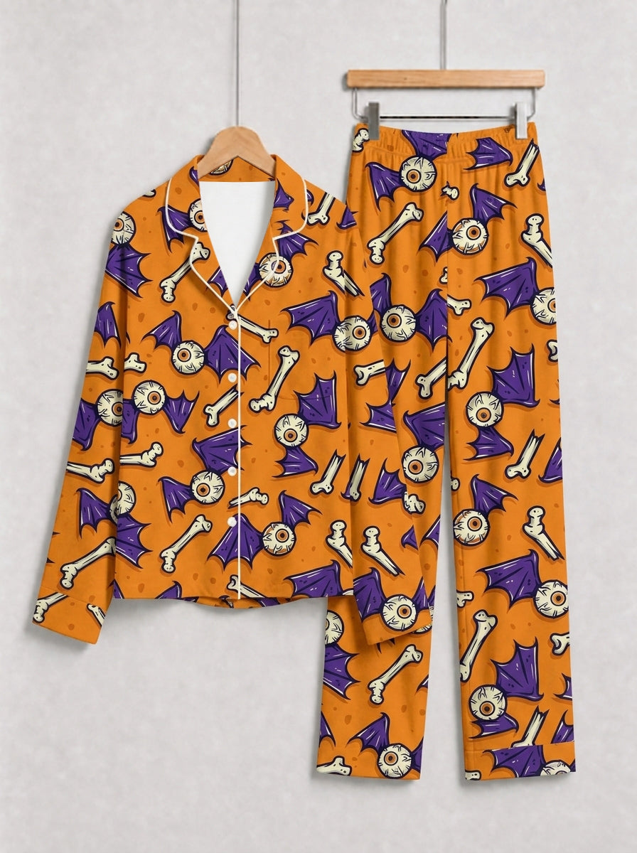 Orange Spooky Eyeball, Bone, and Bat Wing Print Pajama Set